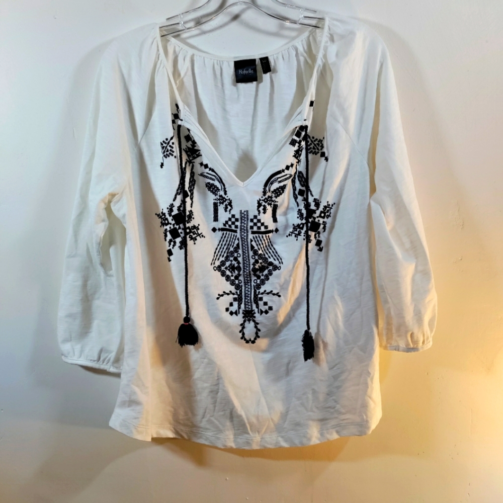 White drawstring embroidered top. Does have a small stain. Details in the pictur